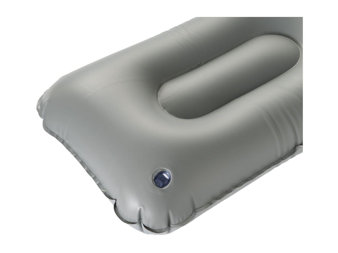 Close-up of a grey inflatable camping pillow with a blue valve.