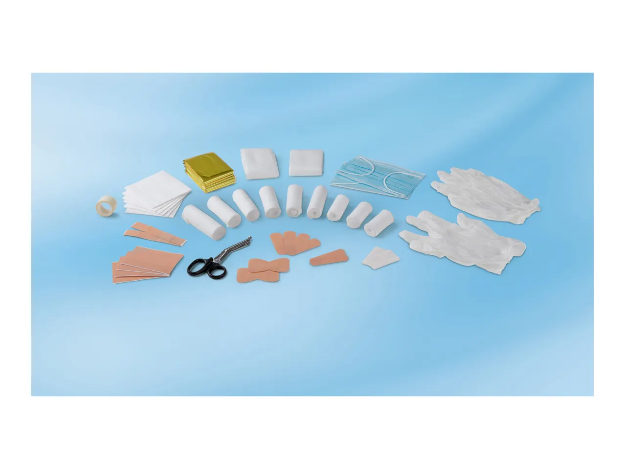 First aid kit contents including bandages, plasters, gloves, masks, and scissors on a blue background.