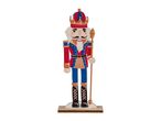 Nutcracker king figurine in red, blue, and gold uniform, holding a staff.