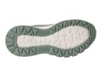 Bottom view of a green and white athletic shoe with a textured sole.