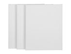 Three blank white stretched canvases for painting, stacked and leaning against each other.