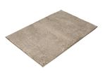 Rectangular beige bath mat with a textured surface