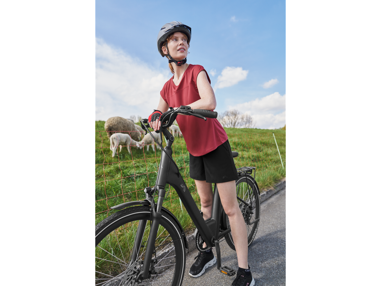 Woman on an e-bike in a rural setting.