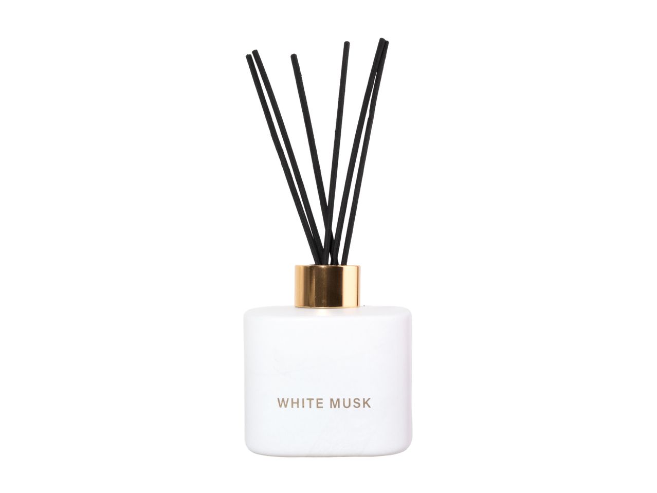 White Musk reed diffuser with a white bottle, gold collar, and black reeds