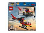 A red and black toy helicopter with a pilot, flying over a city skyline.