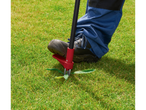 Parkside® Weed Puller in action, removing a weed from a lawn.