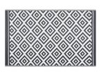 Grey and white outdoor rug with a geometric diamond pattern