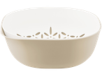 A beige plastic colander and bowl set with a floral design.