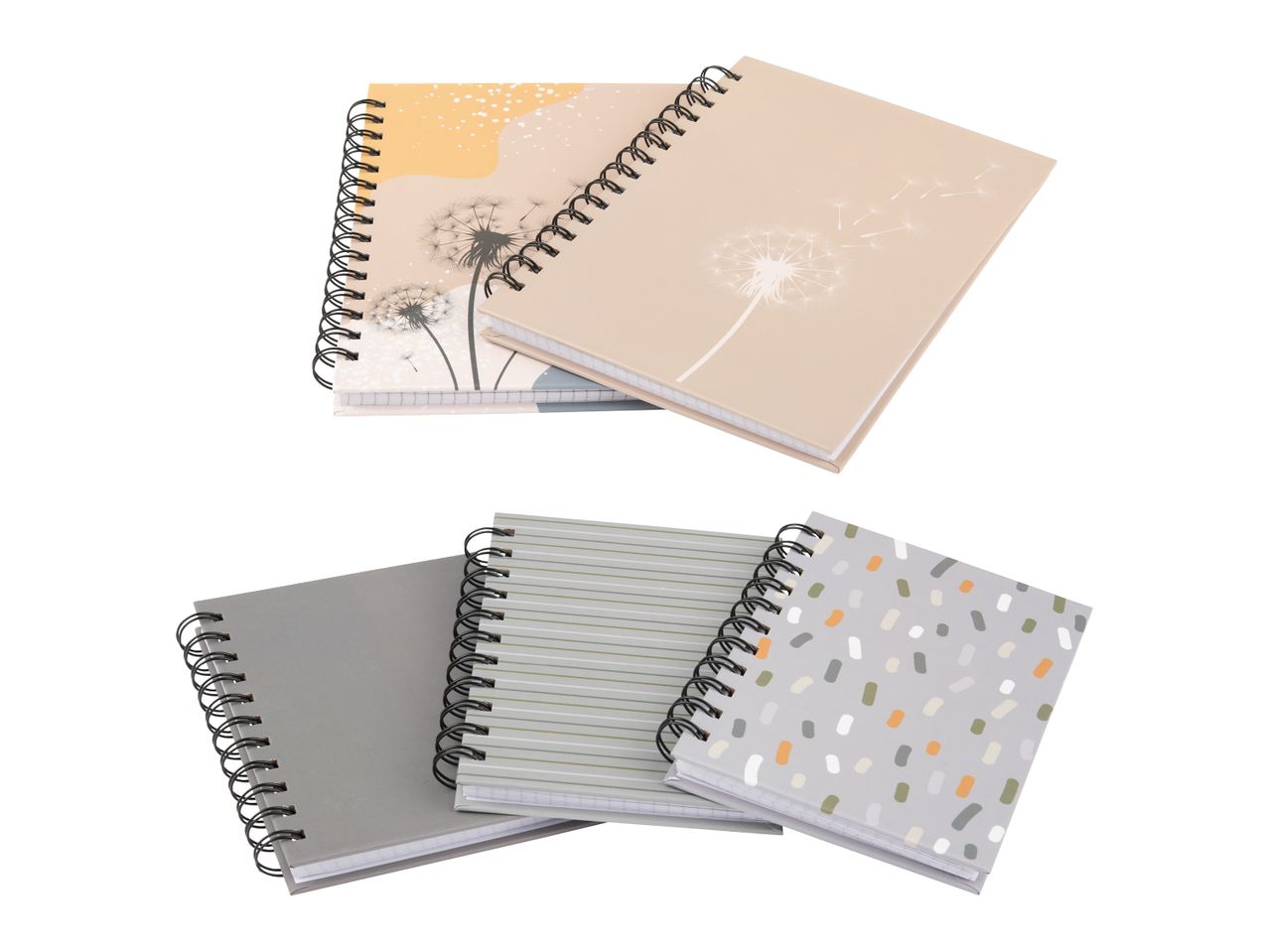 Vier Notizbücher mit Spiralbindung, zwei mit Pusteblumenmuster und zwei mit geometrischen Mustern