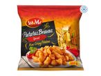 Frozen spiced mini crispy potatoes in a bag, with a Mediterranean village background.