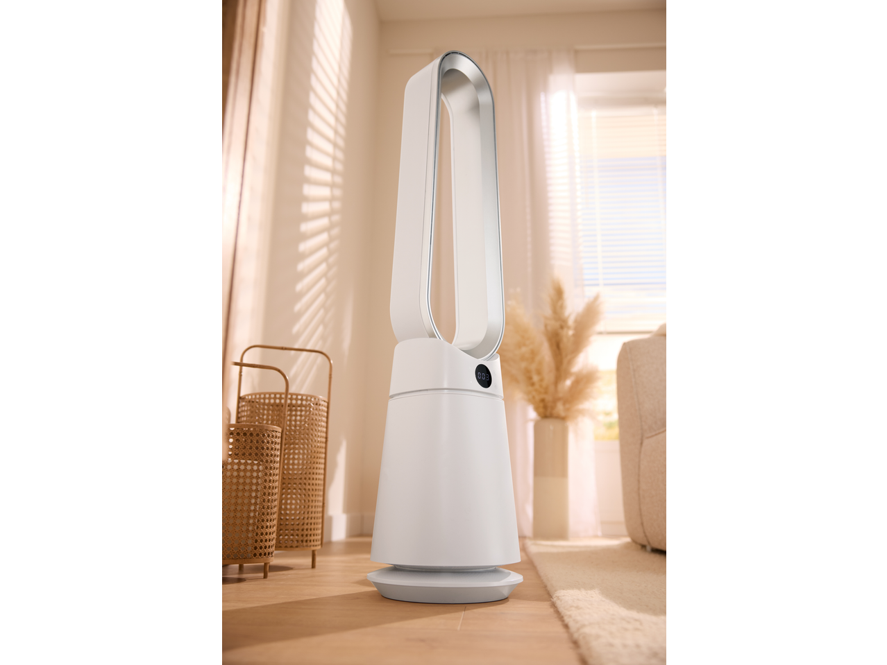 White tower fan with a digital display in a bright room with natural light.