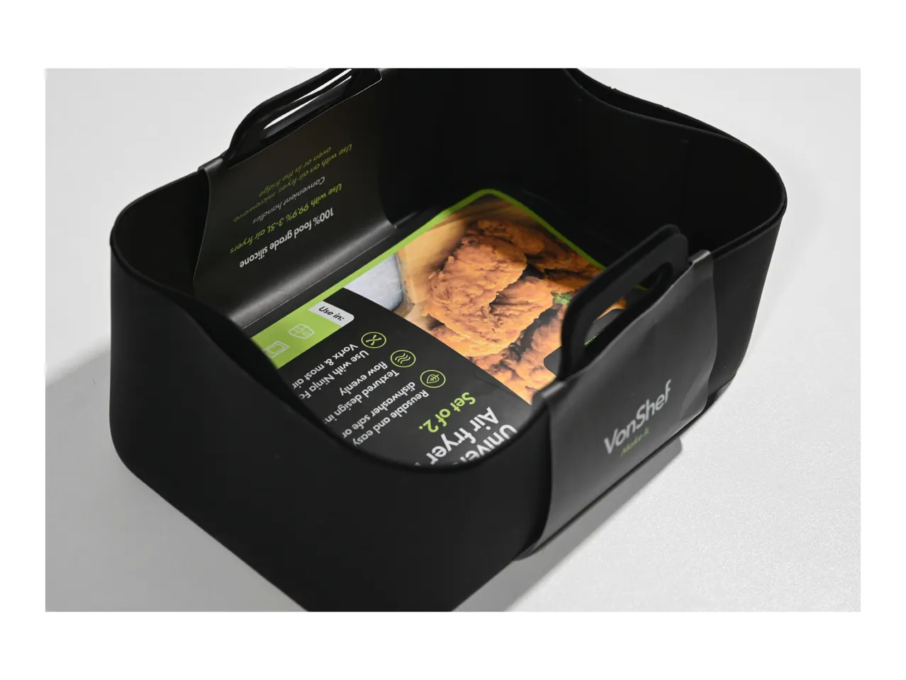 Black silicone air fryer liners with fried chicken and product features.