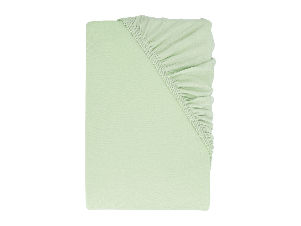 Light green fitted sheet, folded neatly with elasticated edges visible.