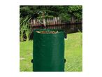 Green garden waste bag filled with leaves, set in a garden by a pond.