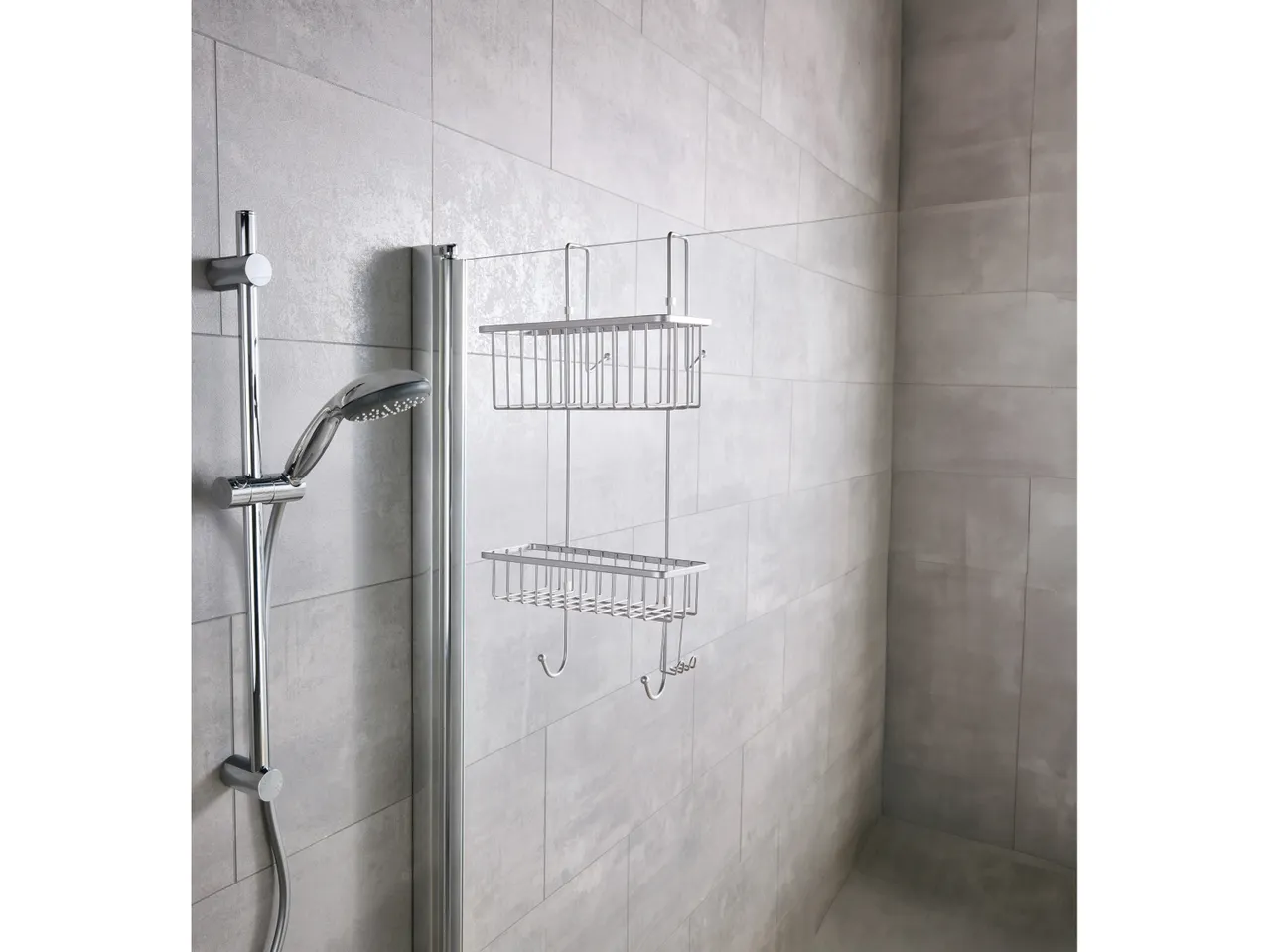 A chrome two-tiered shower Rack is mounted on a bathroom wall.