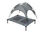 Elevated pet bed with a grey canopy for outdoor use, providing shade and comfort.