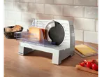 SILVERCREST® Electric Multi-Purpose Slicer with cheese, bread, and tomatoes on a wooden counter.