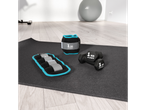 CRIVIT fitness accessories: ankle weights, wrist weights, and dumbbells on a yoga mat.