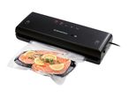 SilverCrest vacuum sealer with salmon fillets and lemon slices in a vacuum bag.