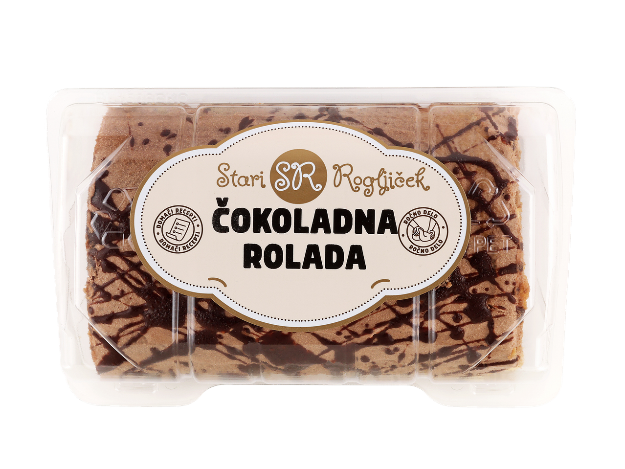 Čokoladna rolada v prozorni embalaži z napisom »Domači recepti« in »Ročno delo«.