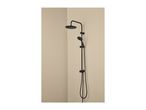 Black shower column with a round overhead shower and a handheld shower in a corner