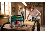 PARKSIDE® 20V Cordless Wet and Dry Vacuum Cleaner connected to a jigsaw in a workshop.