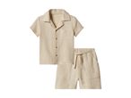 Beige short-sleeved shirt and matching shorts set made from crinkled cotton fabric.