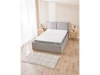 A gray platform bed with a white mattress topper.
