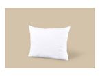 White quilted pillow on a beige background.