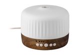 Ultrasonic aroma diffuser with a white ceramic cover and a wooden base