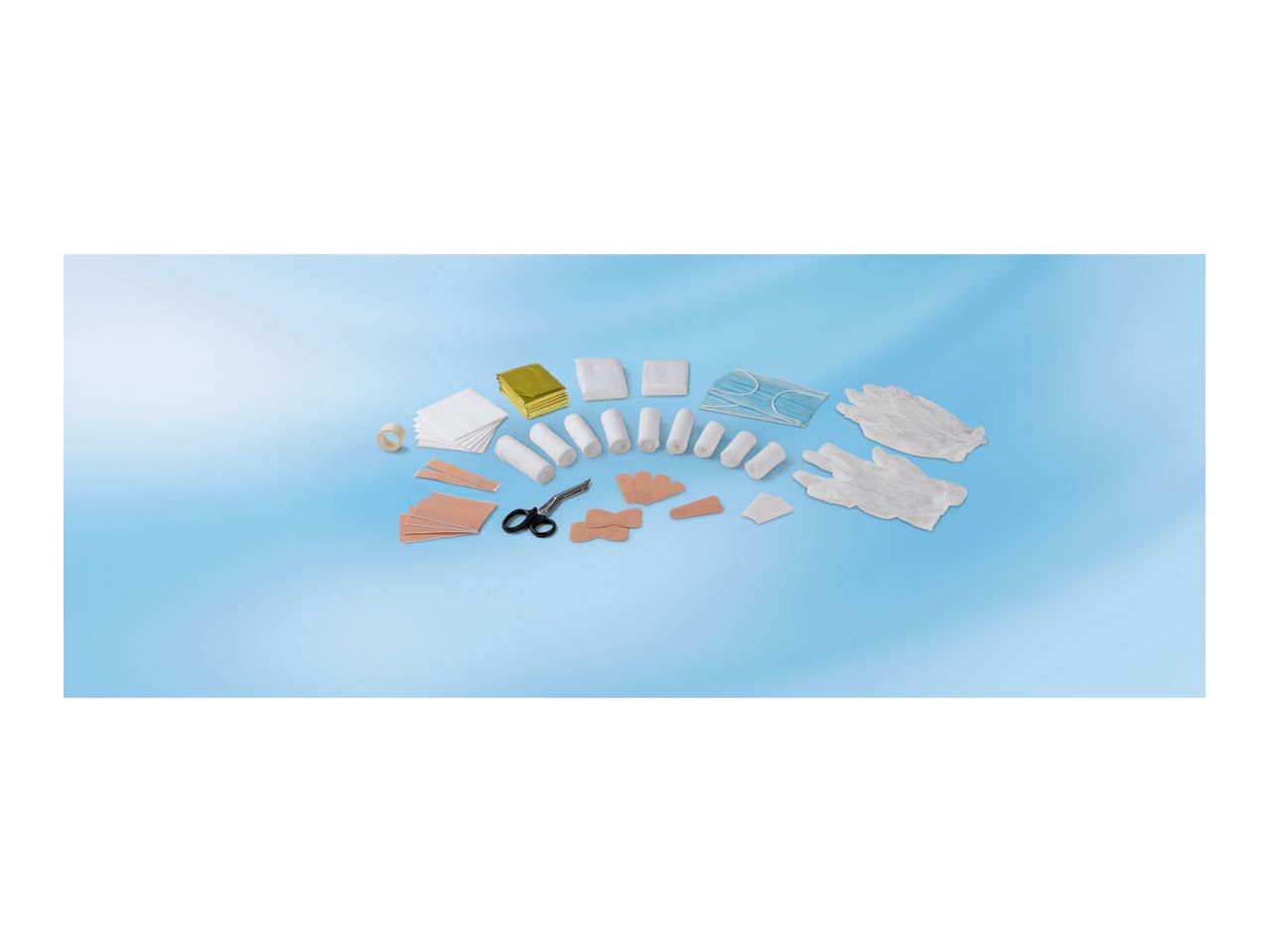 First aid kit contents: bandages, plasters, medical tape, scissors, face masks, and gloves.