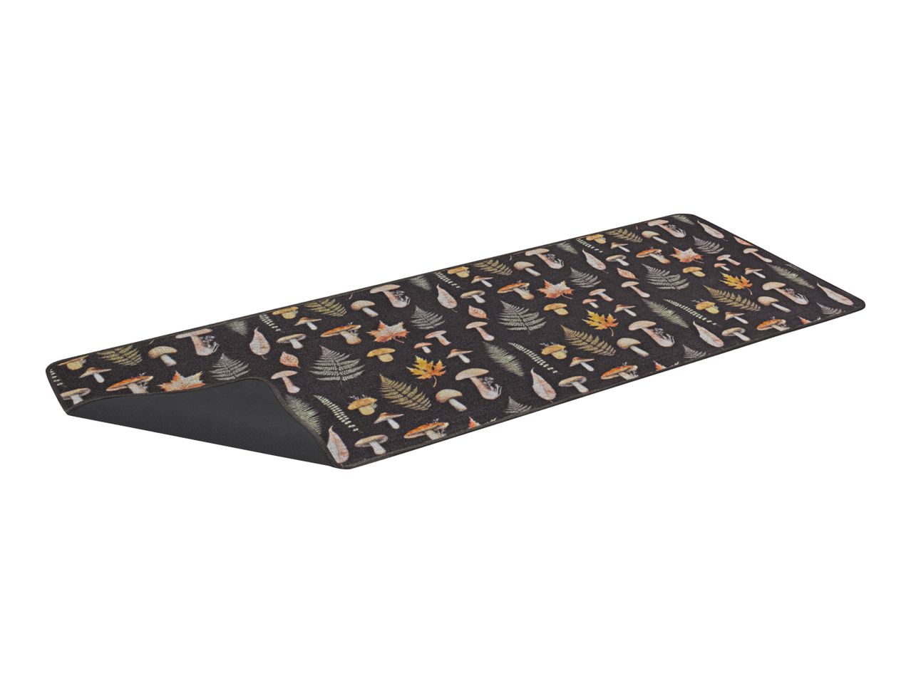 Black kitchen runner with a pattern of mushrooms, ferns, and autumn leaves.