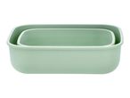 Two light green rectangular food containers, one nested inside the other.