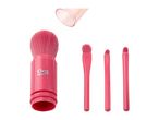 Pink travel makeup brush set with a blush brush, angled brush, and two smaller brushes.