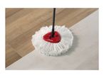 Spin mop cleaning a floor that is half wood and half light-colored tile.