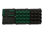 Modular wall storage system with green and black bins and tool holders.