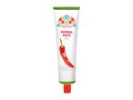White tube of mild paprika paste with a red chili pepper and folk art design.