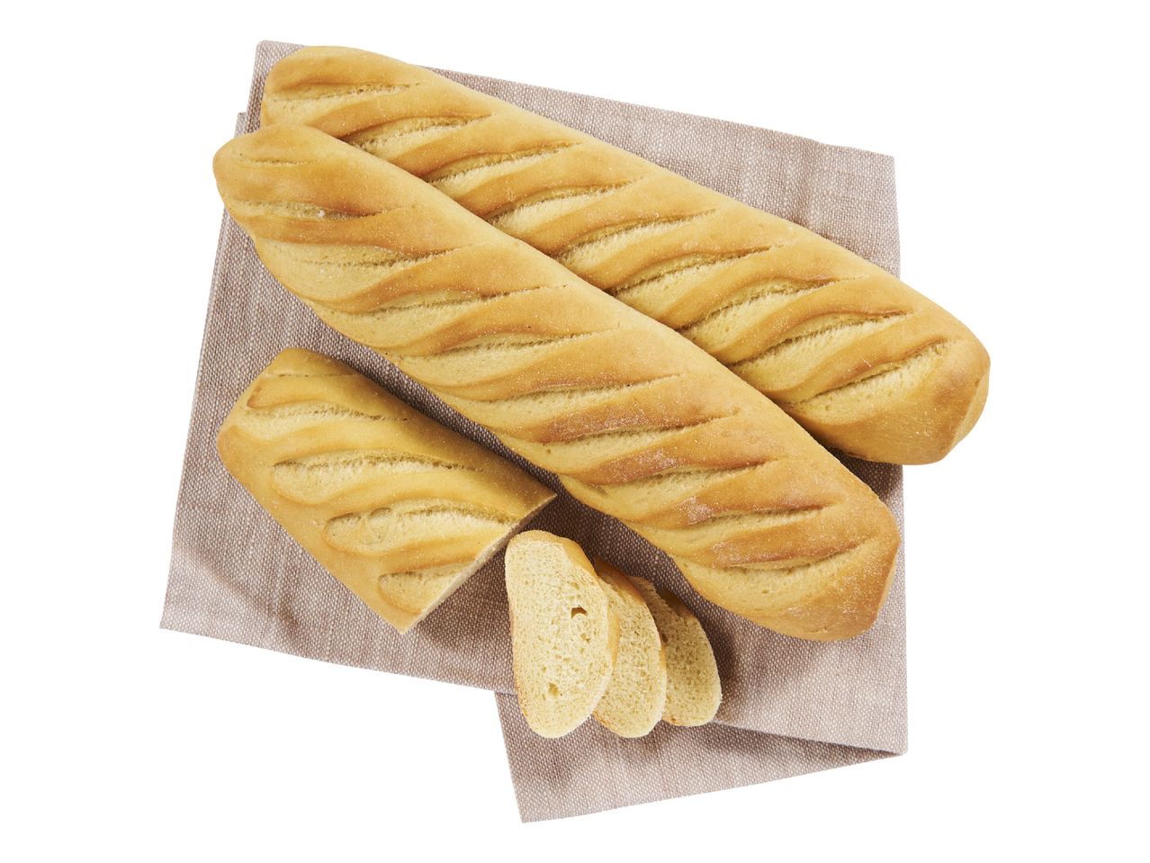 Deux baguettes et du pain tranché sur une serviette en lin.