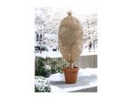 A potted plant wrapped in a protective winter fleece cover on a snowy deck.