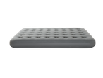 Grey inflatable air mattress with a tufted surface, isolated on a black background.