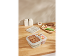 A beige silicone bento box and a clear plastic lunchbox with compartments filled with a healthy lunch.