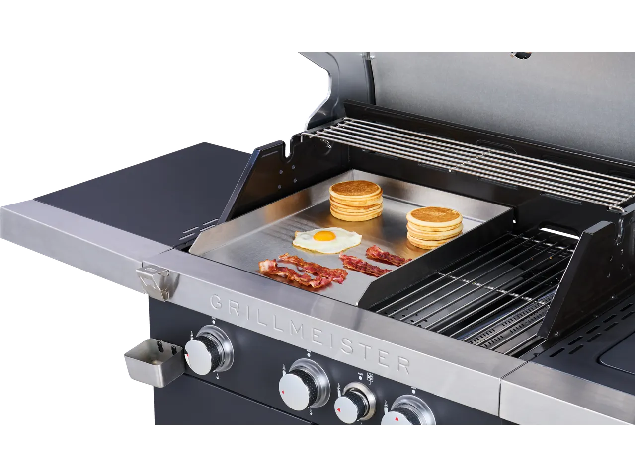 Placa Plancha GRILLMEISTER com panquecas, ovo e bacon na grelha.