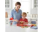 Mother and child packing a Disney Mickey Mouse lunchbox and drink bottle with fruit.
