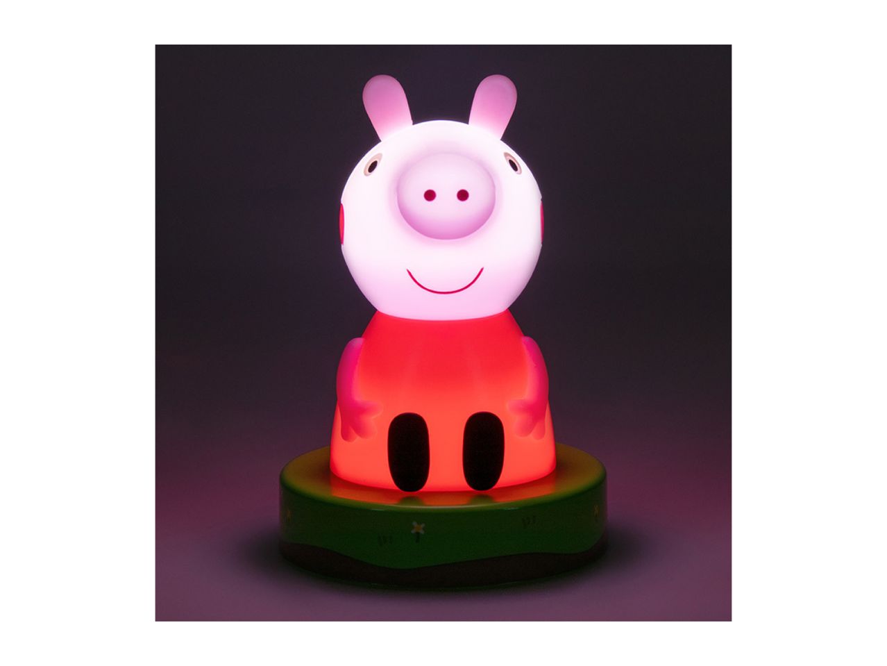 Glowing pig-shaped night light with a red body and pink head on a green base.