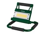 Green and black portable LED work light with a handle and stand