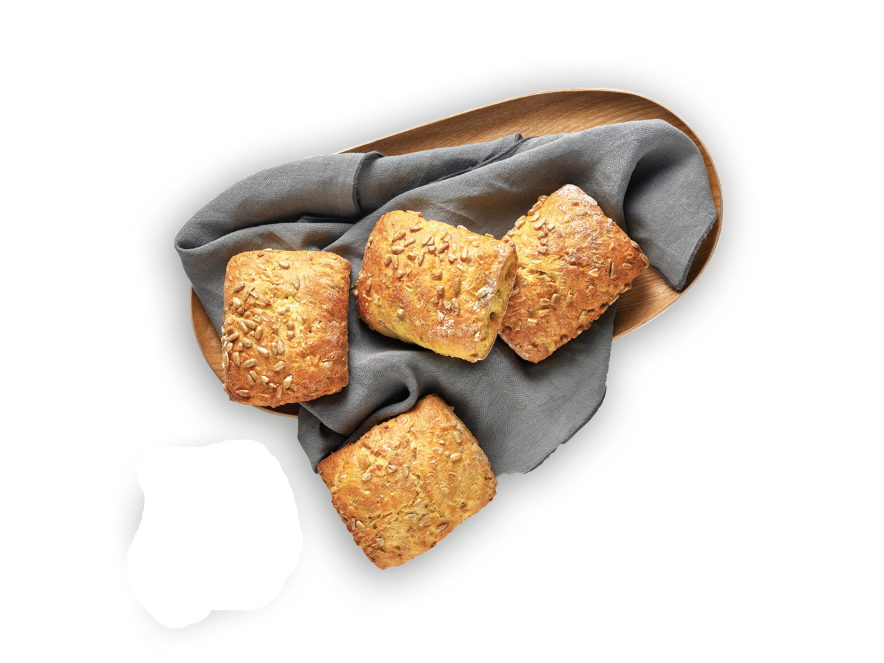 Peciva sa sjemenkama suncokreta na drvenom pladnju s tamnosivom krpom