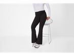 esmara® Ladies' Leggings in black, worn with a white long-sleeve top, sitting on a stool.