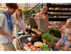Friends grilling burgers at a summer barbecue.