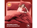 A woman sleeping comfortably in a bed with red bedding, promoting energy saving.
