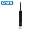 Black electric toothbrush with a blue and green brush head, on a white charging base.